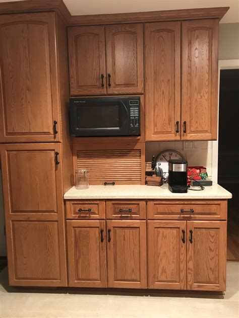 oak cabinets with black hardware